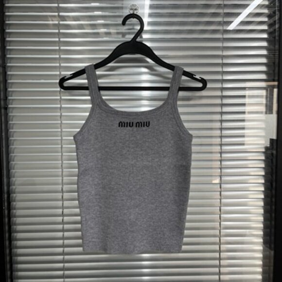 The letter logo on the chest of the Miu Miu pure grey halter vest